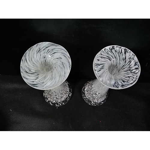68 - A small quantity of collectable glassware to include two white and black spotted candle holders with... 