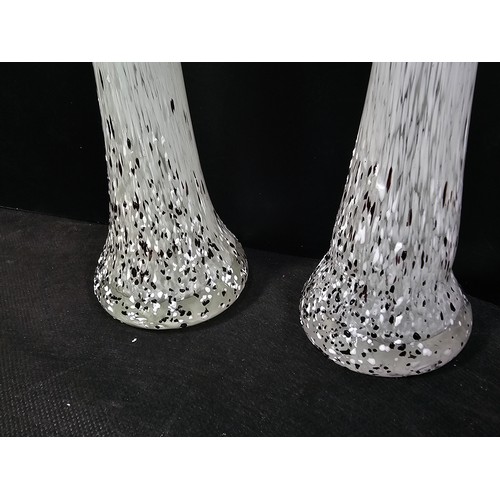 68 - A small quantity of collectable glassware to include two white and black spotted candle holders with... 