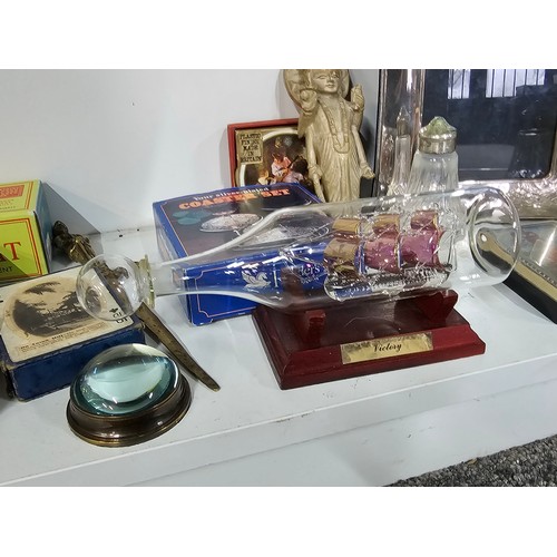 69 - A shelf of collectables to include an art deco style silver plated frame, a collection of engineers ... 