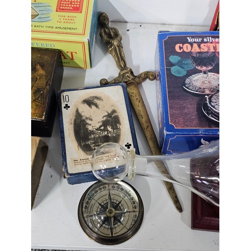 69 - A shelf of collectables to include an art deco style silver plated frame, a collection of engineers ... 