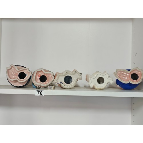 70 - A collection of five Wade pigs to include two babies, mum dad and daughter along with a silver plate... 
