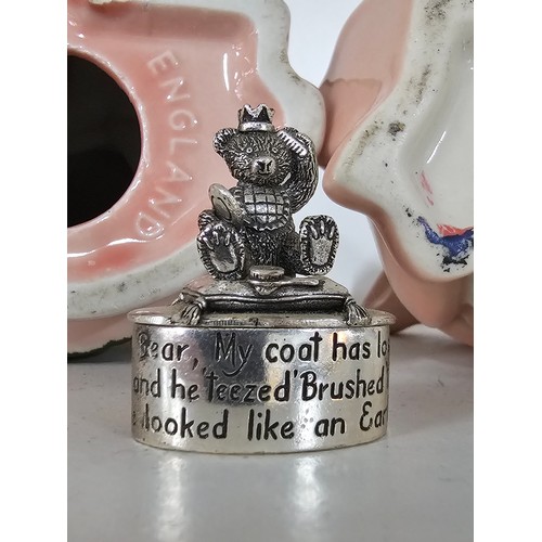 70 - A collection of five Wade pigs to include two babies, mum dad and daughter along with a silver plate... 