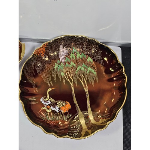 71 - A collection of Carlton ware in the Rouge Royale lustre ware all are hand painted with gilding to th... 