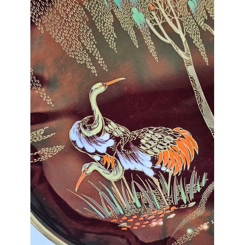 71 - A collection of Carlton ware in the Rouge Royale lustre ware all are hand painted with gilding to th... 
