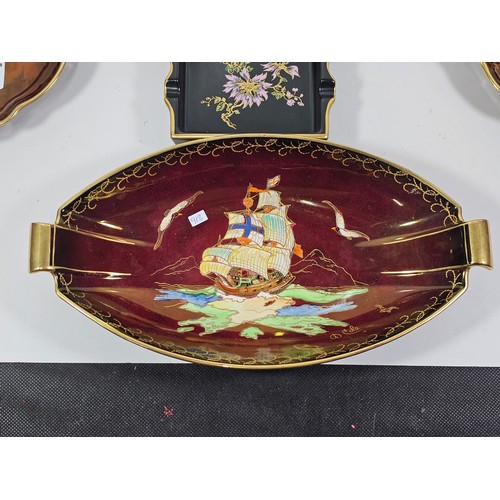 71 - A collection of Carlton ware in the Rouge Royale lustre ware all are hand painted with gilding to th... 