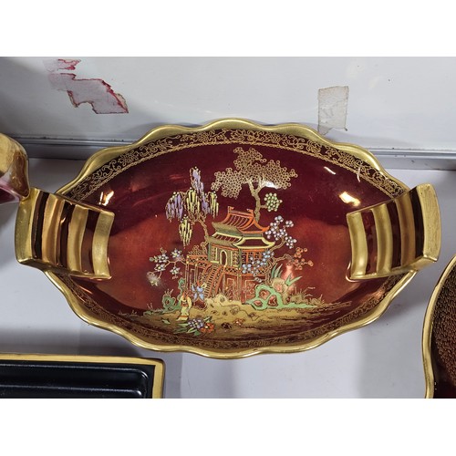71 - A collection of Carlton ware in the Rouge Royale lustre ware all are hand painted with gilding to th... 