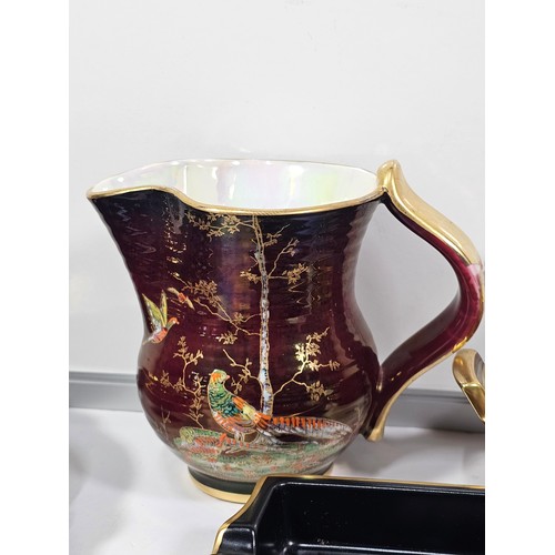 71 - A collection of Carlton ware in the Rouge Royale lustre ware all are hand painted with gilding to th... 