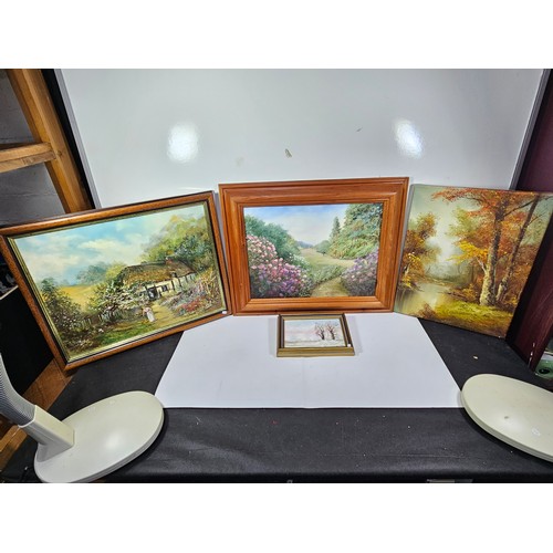 77 - A collection of 4 original framed artwork to include  a country scene with Rhododendrons in the fore... 
