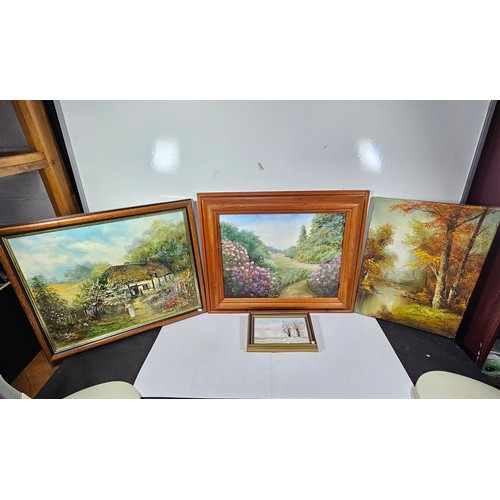 77 - A collection of 4 original framed artwork to include  a country scene with Rhododendrons in the fore... 