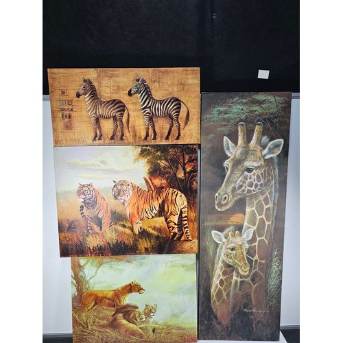 79 - A quantity of 4 stretched canvas prints to include a tall picture of a Giraffe and calf by Roane Man... 