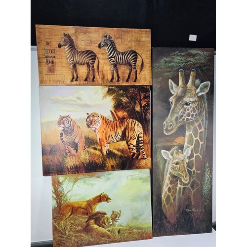 79 - A quantity of 4 stretched canvas prints to include a tall picture of a Giraffe and calf by Roane Man... 