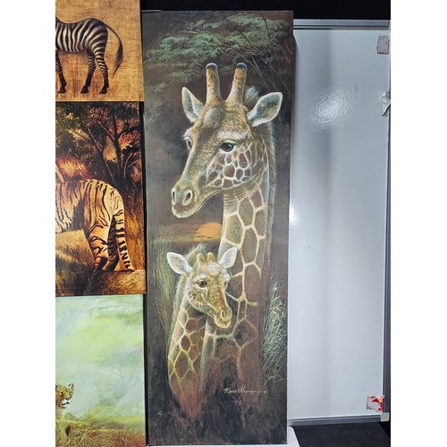 79 - A quantity of 4 stretched canvas prints to include a tall picture of a Giraffe and calf by Roane Man... 