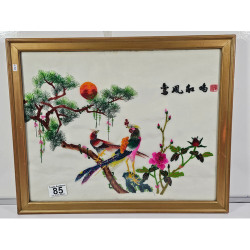 85 - A framed and glazed silk oriental picture depicting 2 golden pheasants n a branch signed to the top ... 
