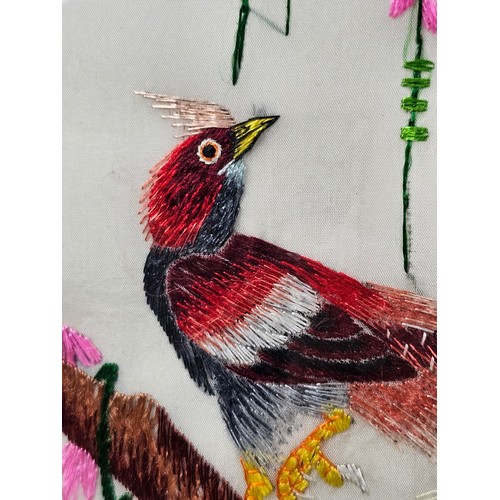 85 - A framed and glazed silk oriental picture depicting 2 golden pheasants n a branch signed to the top ... 