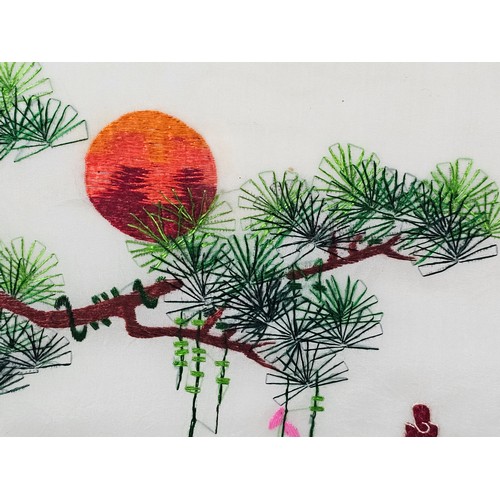 85 - A framed and glazed silk oriental picture depicting 2 golden pheasants n a branch signed to the top ... 