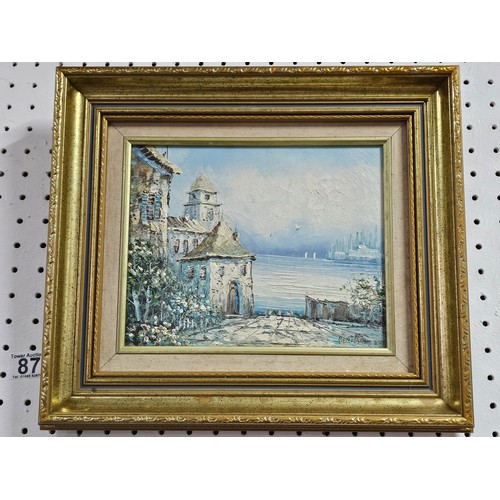 87 - A framed oil on board pallet knife painting of a coastal scene signed to the lower right. In a good ... 