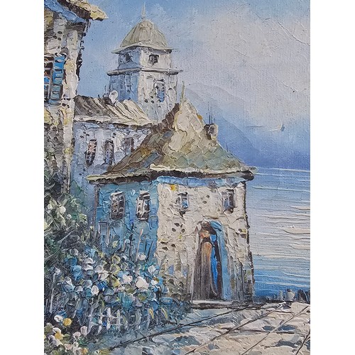 87 - A framed oil on board pallet knife painting of a coastal scene signed to the lower right. In a good ... 