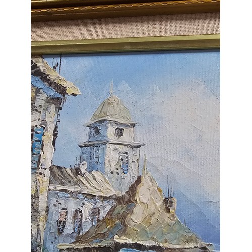 87 - A framed oil on board pallet knife painting of a coastal scene signed to the lower right. In a good ... 