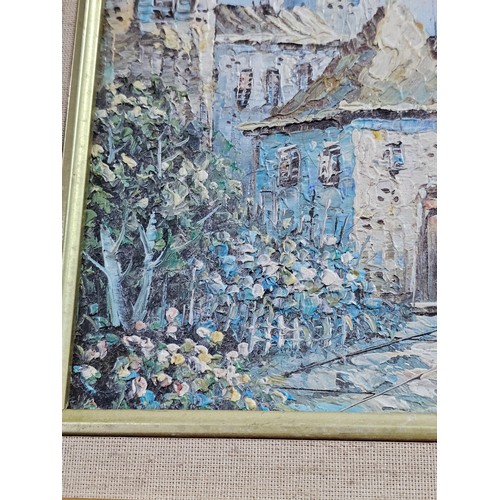 87 - A framed oil on board pallet knife painting of a coastal scene signed to the lower right. In a good ... 
