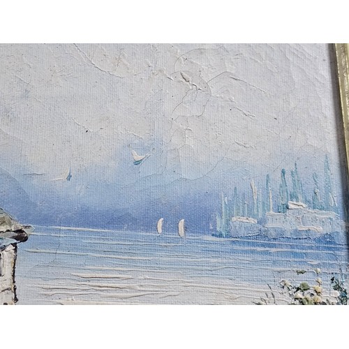 87 - A framed oil on board pallet knife painting of a coastal scene signed to the lower right. In a good ... 