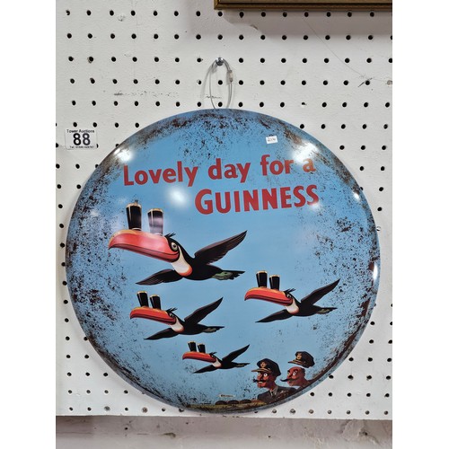 88 - A good quality reproduction tin circular sign for Guinness with Toucans to the front. The sign is in... 