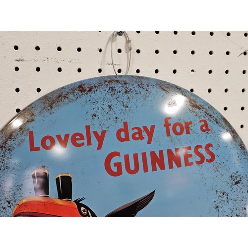 88 - A good quality reproduction tin circular sign for Guinness with Toucans to the front. The sign is in... 