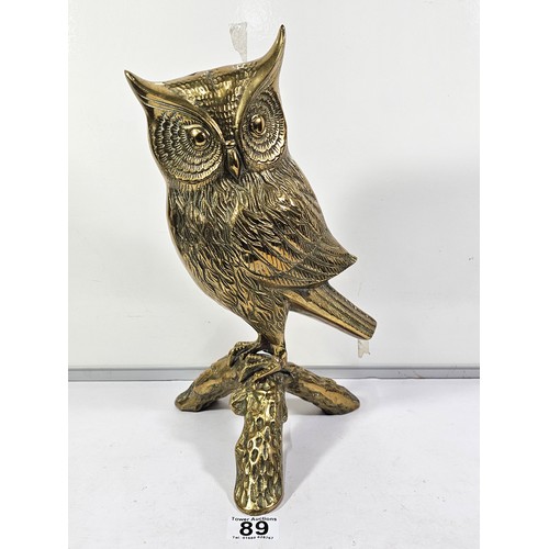 89 - A good quality solid brass owl figure standing on a branch the figure is very well detailed. Has a h... 