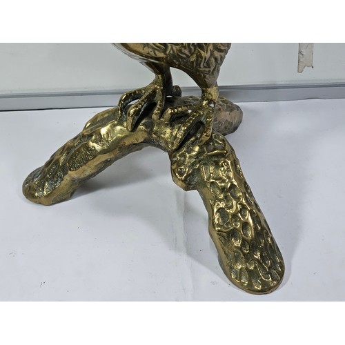 89 - A good quality solid brass owl figure standing on a branch the figure is very well detailed. Has a h... 