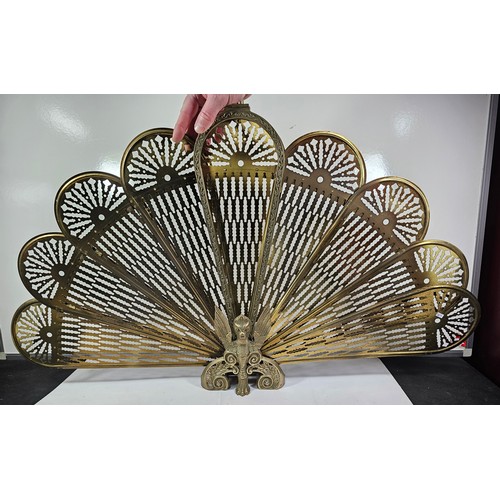 90 - A brass peacock fireguard. All pieces are present but some require re-attaching,. The phoenix image ... 