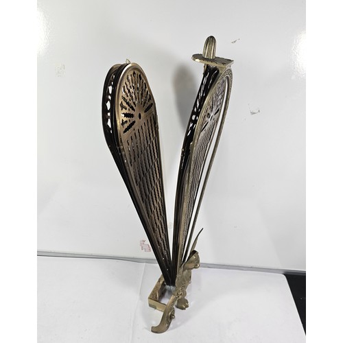90 - A brass peacock fireguard. All pieces are present but some require re-attaching,. The phoenix image ... 