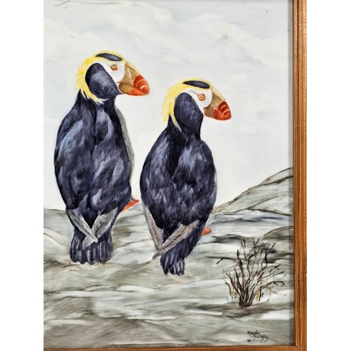 91 - A collection of 3 tiled pictures to include a hand painted framed tile picture of 2 puffins signed t... 