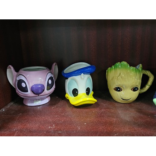 100 - A collection of 10 character mugs to include 3 Star Wars mugs of Baby Yoda, a Disney Mickey and Frie... 