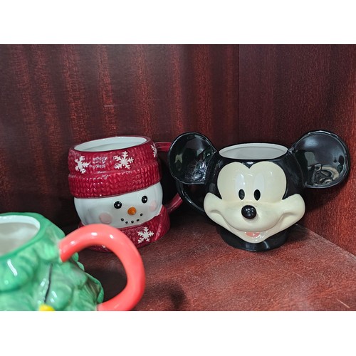 100 - A collection of 10 character mugs to include 3 Star Wars mugs of Baby Yoda, a Disney Mickey and Frie... 