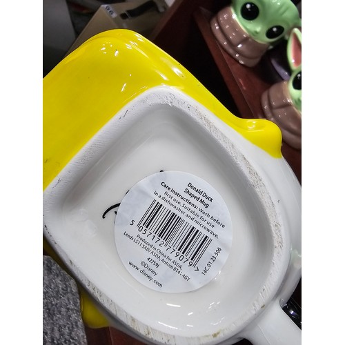 100 - A collection of 10 character mugs to include 3 Star Wars mugs of Baby Yoda, a Disney Mickey and Frie... 