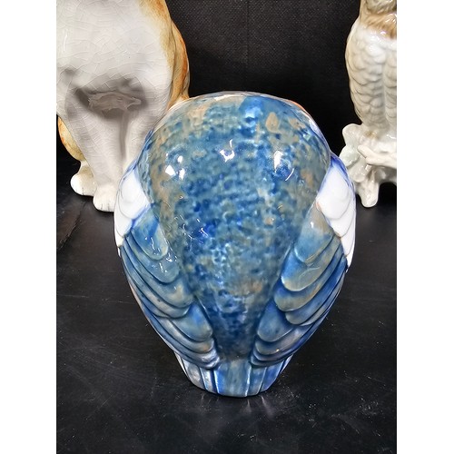 101 - A small collection of figurines to include a white ceramic cat by Beswick stamped 1867, a John Rayfo... 