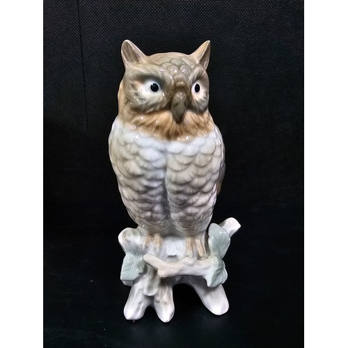 101 - A small collection of figurines to include a white ceramic cat by Beswick stamped 1867, a John Rayfo... 