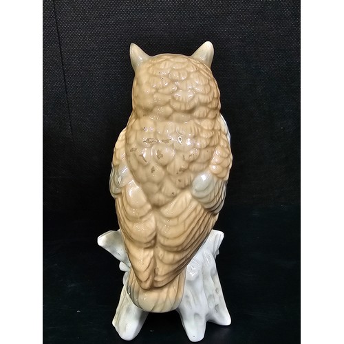 101 - A small collection of figurines to include a white ceramic cat by Beswick stamped 1867, a John Rayfo... 