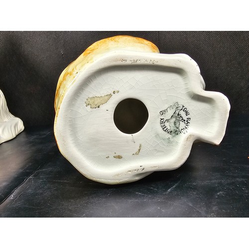 101 - A small collection of figurines to include a white ceramic cat by Beswick stamped 1867, a John Rayfo... 