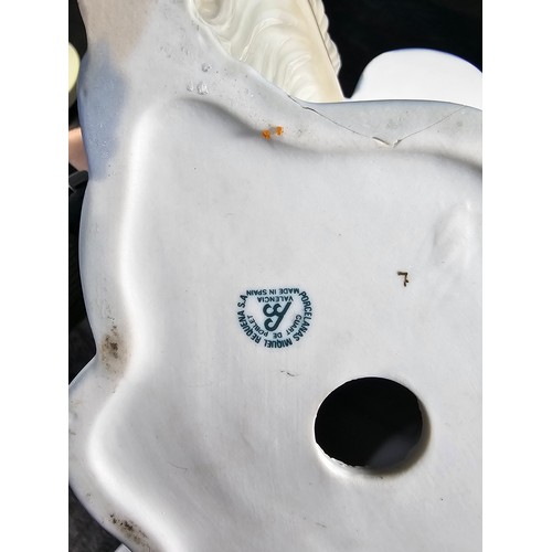 102 - A large quantity of collectables to include an Italian Pottery piece of a lady pushing a Wheelbarrow... 