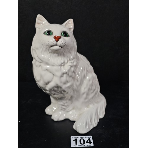 104 - A good quality ceramic Beswick cat figure which is well detailed with green painted eyes stamped 186... 