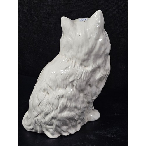 104 - A good quality ceramic Beswick cat figure which is well detailed with green painted eyes stamped 186... 