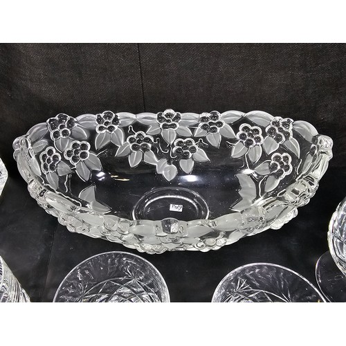 105 - A quantity of glassware to include a cut glass crystal decanter complete with stopper along with 4 g... 