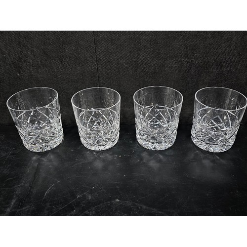 105 - A quantity of glassware to include a cut glass crystal decanter complete with stopper along with 4 g... 