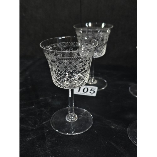 105 - A quantity of glassware to include a cut glass crystal decanter complete with stopper along with 4 g... 