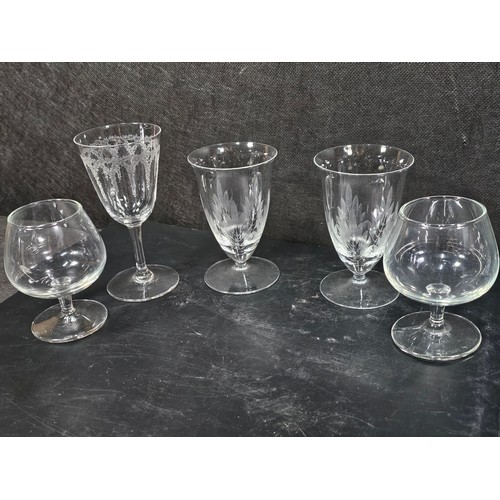 105 - A quantity of glassware to include a cut glass crystal decanter complete with stopper along with 4 g... 