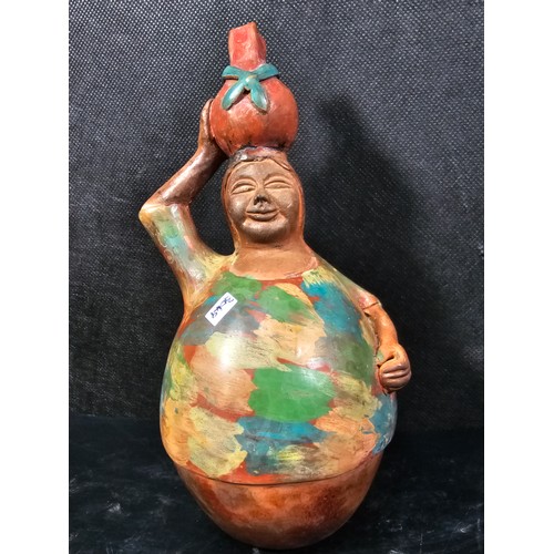107 - A pair of good quality handmade Peruvian bulbous figures both are hand signed to the base, one of a ... 