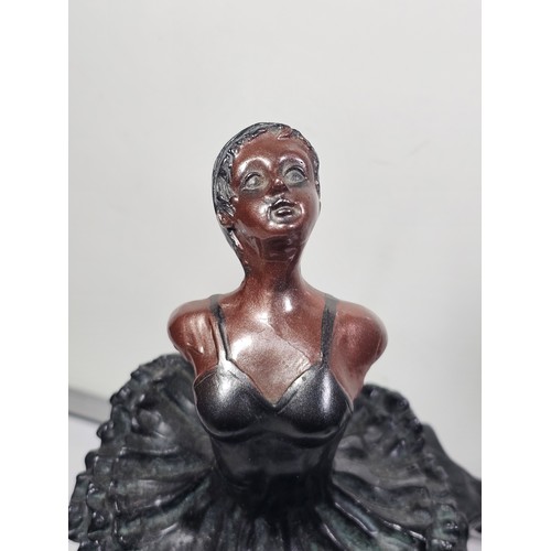 108 - A collection of 4 figurines in resin to include a Ballerina standing by a column, a dancer sitting o... 