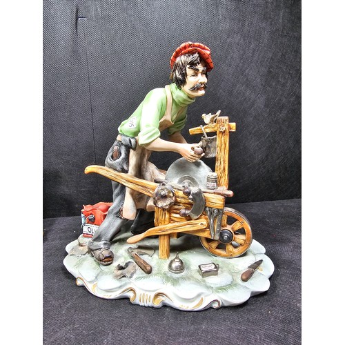109 - A collection of 3 Capodimonte figurines to include a craftsman along with a tramp on a park bench an... 