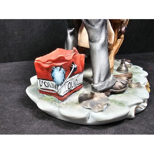 109 - A collection of 3 Capodimonte figurines to include a craftsman along with a tramp on a park bench an... 
