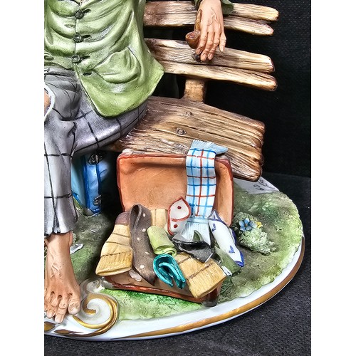 109 - A collection of 3 Capodimonte figurines to include a craftsman along with a tramp on a park bench an... 